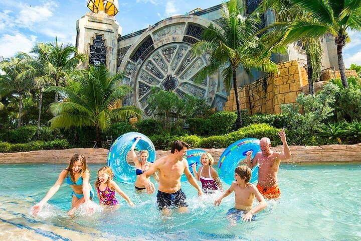 Experience the joy of splashing through water slides and relaxing in pristine pools with the iconic Atlantis in the background offering a perfect family getaway in Dubai.